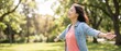 © Andriko - A Happy Asian Woman With Open Arms Deeply Breathing Fresh Air In A Peaceful Green Summer Forest Park