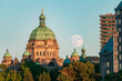 © Geoffrey Pelacio/Stocksy - Moon over parliament