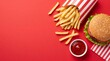 © artifexgenz - Delicious beef burger with crispy french fries and tomato ketchup sauce on vibrant red background