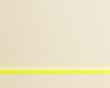 © Ryzhkov - Cream colored toothy paper with a yellow highlighter stripe, featuring a tactile fiber texture and soft lighting for insurance paperwork backgrounds