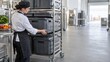 © Sugar Love Love - Chef arranging thermal containers in catering kitchen