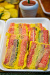© 완수 안 - Colorful savory pan fried skewer pancakes inside a styrofoam tray are displayed for sale at a traditional five day market in South Korea.