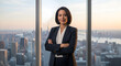 © putra - Confident businesswoman wearing professional dark suit standing before large windows overlooking the hazy urban skyline