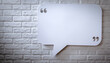 © Muhammad - Blank Speech Bubble Sign on Textured White Brick Wall