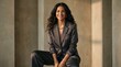 © NUR - Confident Professional Businesswoman in Grey Suit Smiling in a Minimalist Modern Office Setting