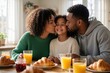 © miss irine - Loving parents kiss daughter while having breakfast with croissants and orange juice. Family enjoys morning meal together at home table, warm sunlight streams through window.