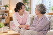 © DARU STOCK - Korean caregiver providing companionship and support to a senior woman at home