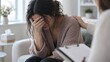 © Glyph Studio - Depressed woman crying in therapy session, upset patient receiving psychological support from counselor, mental health consultation with professional therapist