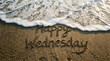 © Auliyanurhikmawati  - Happy Wednesday text handwritten on sandy beach shore with ocean wave foam splashing