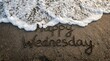 © Auliyanurhikmawati  - Happy Wednesday message written on wet ocean beach sand with sea foam wave washing over