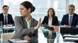 © MDMAZAHARULISLAM - Female business professional in gray suit refusing smartphone at glass conference table, hand raised in rejection while colleagues observe, modern corporate meeting room setting