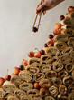 © Alongkorn - Gourmet stack of golden crepe rolls adorned with fresh cherries, ready for a sweet breakfast or dessert presentation