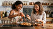 © 123sasha - Two girls seasoning food in kitchen