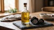 © Cahya - Glass bottle of infused truffle oil displayed next to fresh black truffles on a slate board, representing gourmet Italian ingredients and luxury culinary seasoning