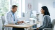 © Begu Designs - Male physician having consultation with a female patient in a bright modern medical clinic office