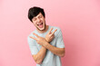 © luismolinero - Young Russian man isolated on pink background smiling and showing victory sign