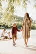 © BGStock72 - Joyful moments by the water: A mother and son share a laugh
