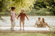 © BGStock72 - Joyful family moments at the lakeside with laughter and connection