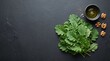 © ety - Fresh green kale leaves with walnuts and olive oil on a dark slate background