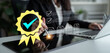 © InfiniteFlow - Businesswoman Signing Documents with Digital Check Mark and Award Medal Symbolizing Productivity and Achievement in Modern Office Environment. Glyphic.
