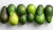© fakhrigigih - Fresh Green Avocados Arranged on a White Background