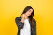 © Daniel - Woman standing with eyes closed, gently massaging her neck and shoulder to alleviate pain, stiffness, and discomfort, illustrating concepts of stress, injury, and poor posture