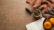 © Iwan - Relaxing autumn flat lay with a cup of hot tea, open journal, soft sweater and pumpkins on a rustic wooden table.