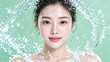 © tangmo.pa - Beautiful Asian woman with glass skin surrounded by a refreshing water splash