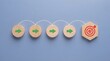 © habib - Business process flow with wooden blocks showing a path to a goal target