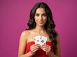 © VecorWing - Woman in red dress holding two aces playing cards against pink background