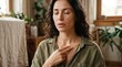 © Elowen - Serene woman practicing EFT emotional freedom technique tapping on chest at home