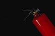 © mykhailo - Fire extinguisher for safety and emergency response in a dark setting