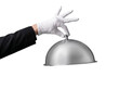 © Napapon - Server's hand in uniform stylishly lifting a shiny lid
