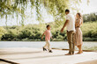 © BGStock72 - Joyful family moment on a serene dock by the tranquil lake