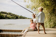 © BGStock72 - Father and sons enjoying a peaceful fishing day by the riverside