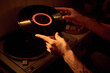 © Mediaphotos - Young Caucasian adult placing vinyl record on turntable player at home. Close up shot suitable for music marketing, retro audio entertainment, lifestyle blogs and hobby content