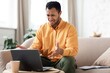 © Prostock-studio - Worried Black Male Adult Reflecting Stress While Working On Laptop At Cozy Home Environment, Facing Challenges In Work, Feeling Frustrated And Overwhelmed With Tasks And Responsibilities.