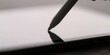 © Nina - Close up of a digital stylus pen touching a blank screen representing technology and creativity