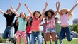 © Chotijah - A group of happy teenagers leaping in the air outdoors.