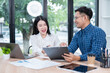 © panomporn - A team of computer business professionals in an office company.