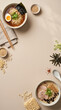 © Arqha Works - Top view of Japanese ramen soup bowls and raw ingredients on beige background with center copy space