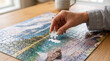 © Inspire Shots Hub - Hand placing the final piece of a landscape puzzle, symbolizing completion, problem-solving, and leisure, perfect for relaxation and hobby concepts