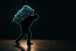 © Victoriia - Silhouette carrying a huge glowing stack of paper, burden concept