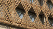 © primipil - Geometric triangular facade pattern on modern architecture building exterior with concrete wall. Concept of triangles, lattice.