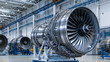 © Akash - A shiny modern aircraft jet engine displayed in a brightly lit industrial manufacturing factory. Aerospace engineering concept for commercial aviation.