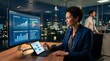 © Usama - A professional woman analyzes financial data on a computer screen and tablet in an office with business professional reviews security analytics computer