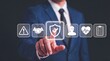 © mainul19islam - Businessman pointing at security shield icon with safety checkmark symbol for industrial compliance.