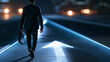 © Laura - Faceless man in a suit walking toward an illuminated arrow on a dark road while carrying a briefcase, career direction concept, with copy space