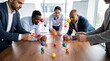 © Shamshad - Diverse professional business team collaborating around a wooden table while assembling a complex colorful molecular model for scientific research planning