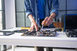 © Charlie's - Male IT Engineer Installing Hardware Equipment and Upgrading Computer Motherboard Components for Professional Technology Service Business.